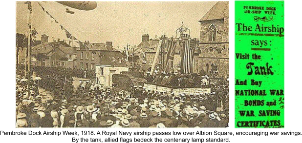 ( Pembroke Dock Airship Week, 1918. A Royal Navy airship passes low over Albion Square, encouraging war savings. By the tank, allied flags bedeck the centenary lamp standard.